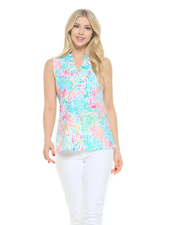 woman wearing multicolor v-neck sleeveless top with white denim