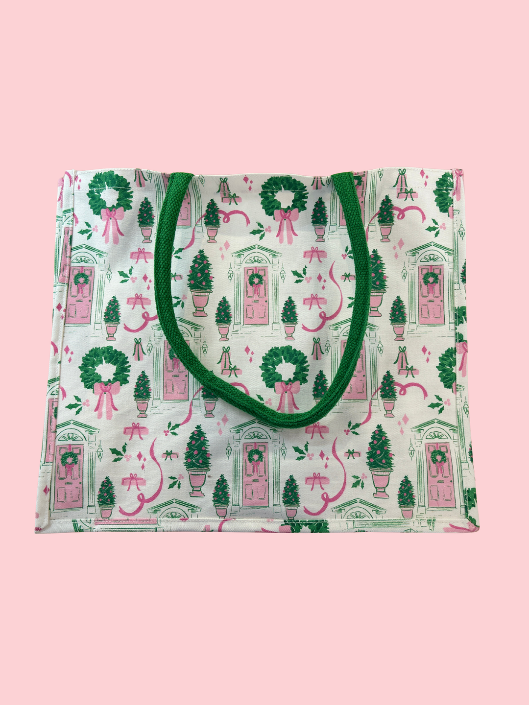 Reusable shopping bag with festive design on a pink background