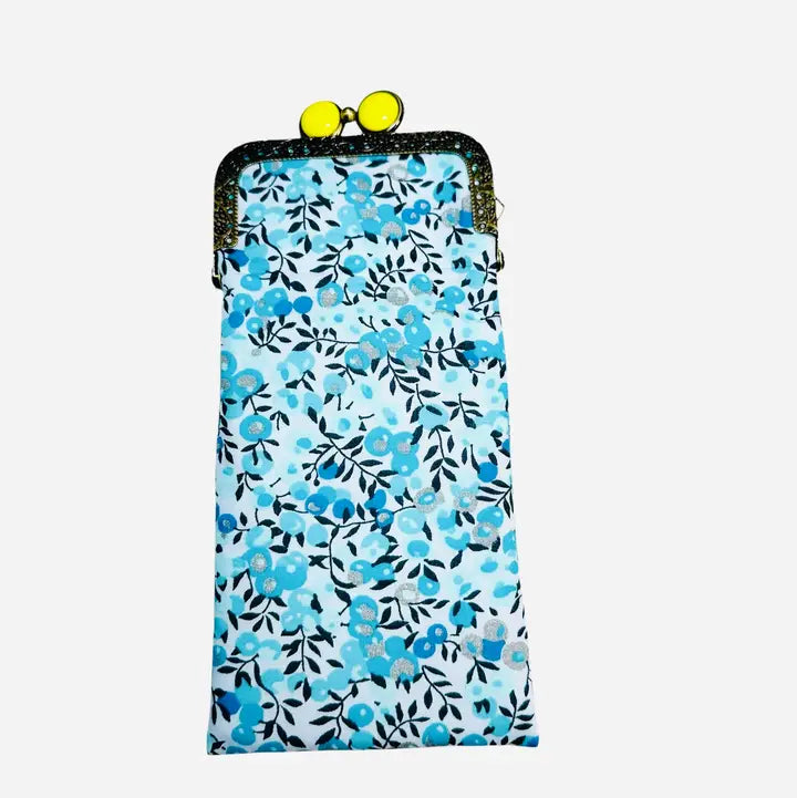 Floral patterned pouch with yellow buttons on a white background