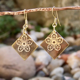 dangle earrings with bronze diamond shaped charms and dainty gold flower charm 