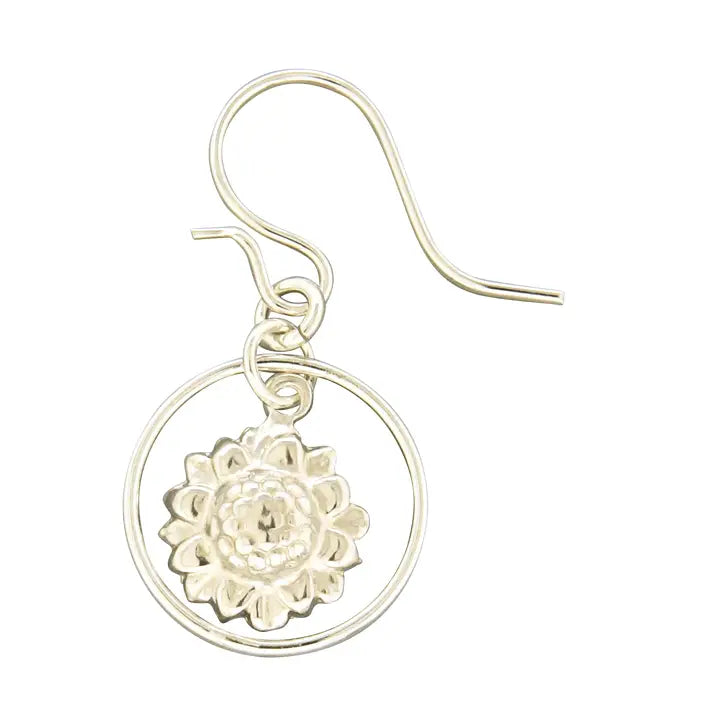 Silver earring with floral design on a white background