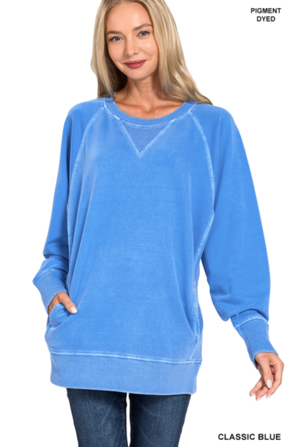 Woman wearing a blue sweatshirt on a white background