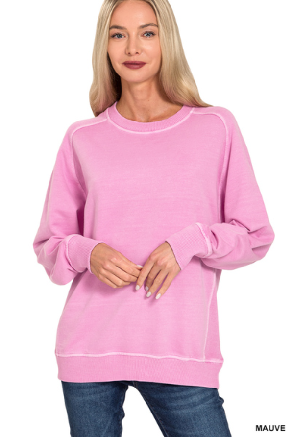Woman wearing pinkish sweatshirt 