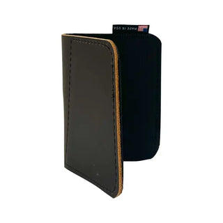Black leather wallet with brown edge on a white background
