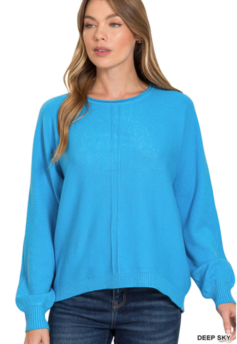 Woman wearing a blue sweater on a white background