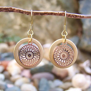 gold dangle earrings with hoop and mandala designed circle charm