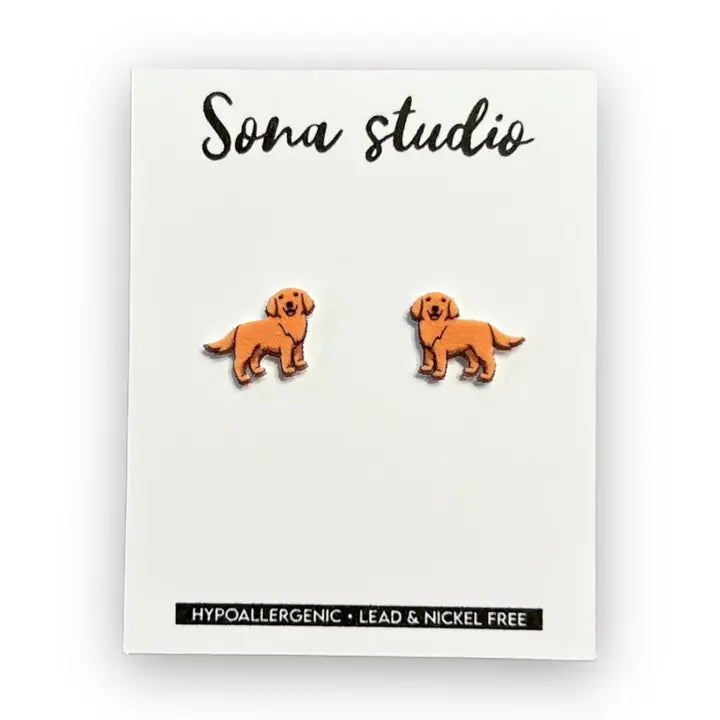 Dog-shaped earrings on a Soma Studio card with hypoallergenic and lead-free information.