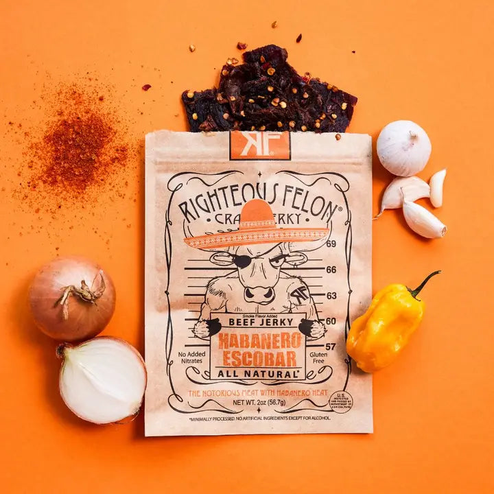 Righteous Felon beef jerky package with ingredients on an orange background