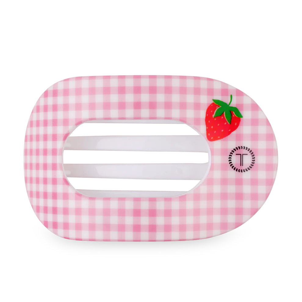 Pink gingham hair clip with a strawberry design on a white background