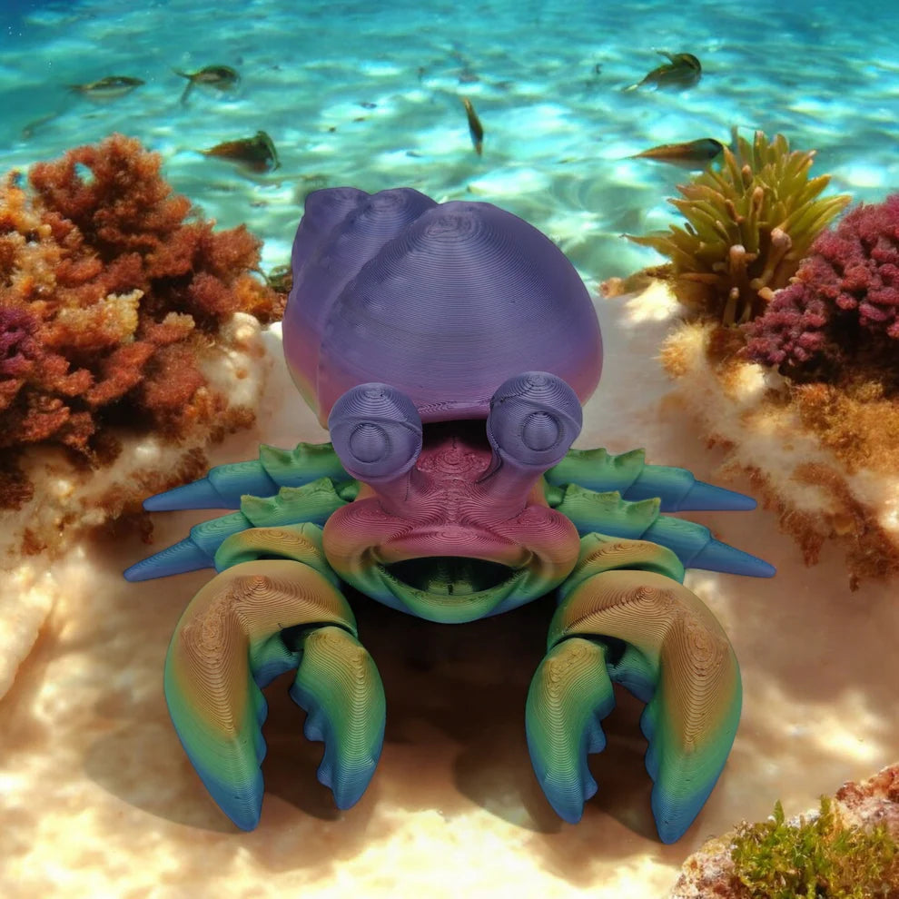 Colorful toy crab on a coral reef with fish swimming around