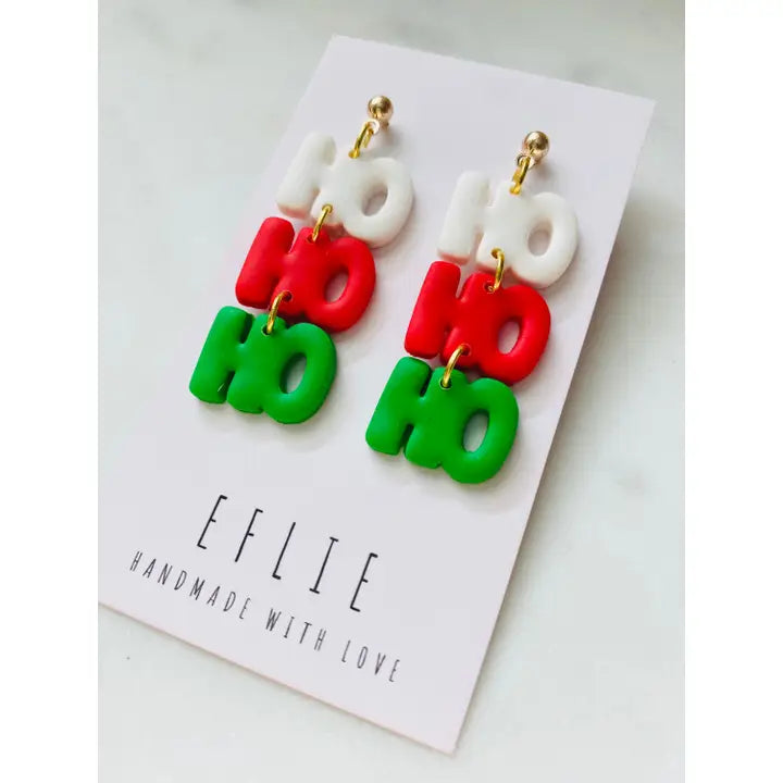 Colorful 'HO HO HO' earrings on a white card with 'EFLIE' branding.