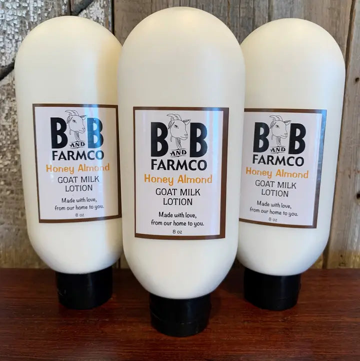 three bottles of white honey almond lotion on a rustic background