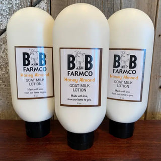 three bottles of white honey almond lotion on a rustic background