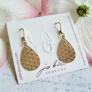 gold tear drop shaped dangle earrings