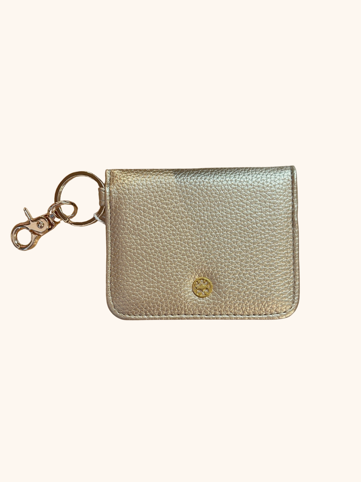 Gold metallic keychain cardholder on a white background