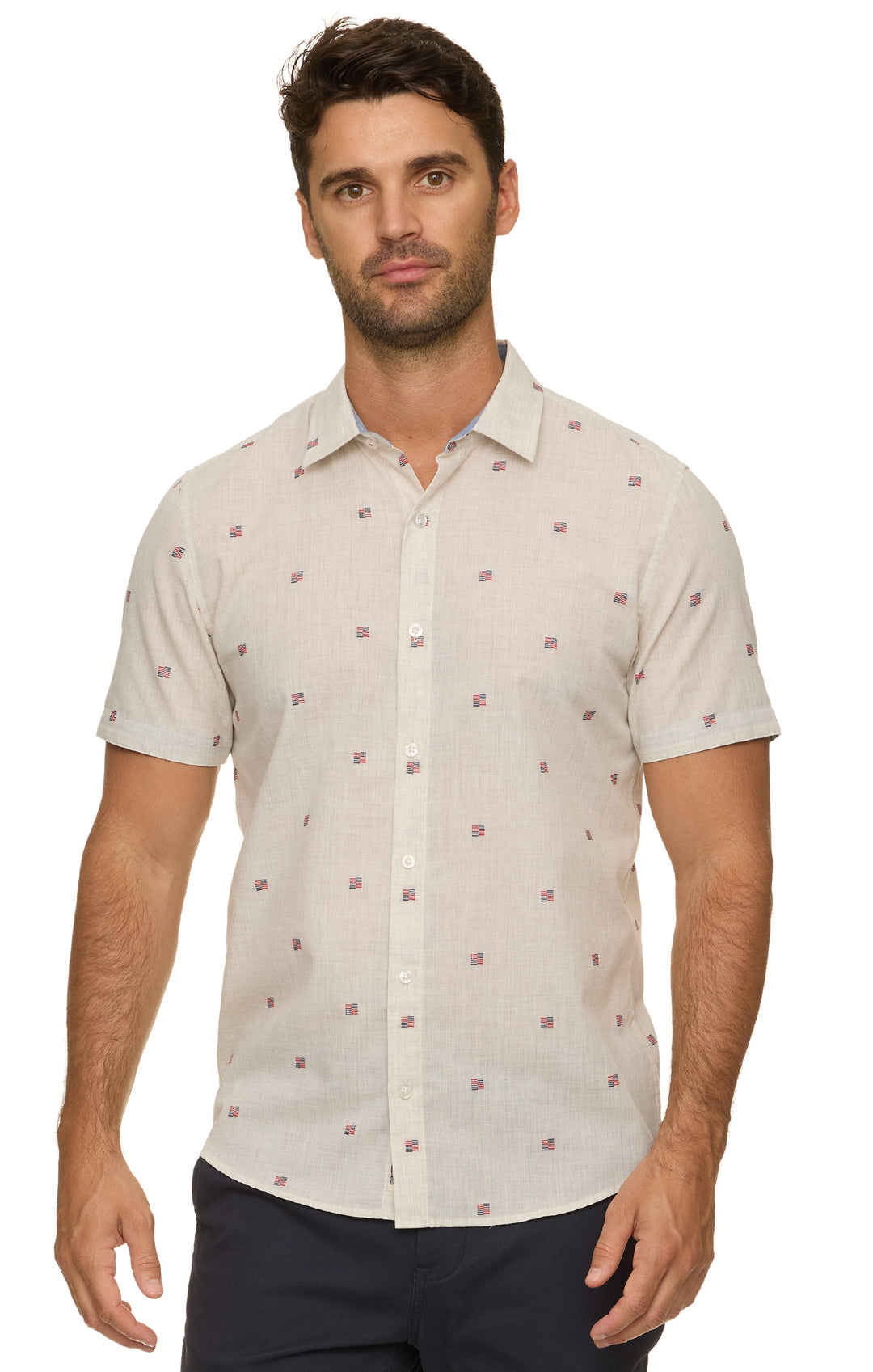 Man wearing a beige short-sleeve shirt with a subtle pattern on a white background