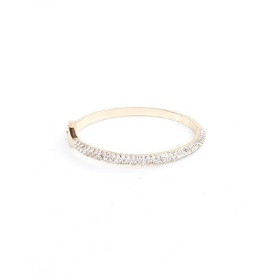 Gold bracelet with small diamonds on a white background