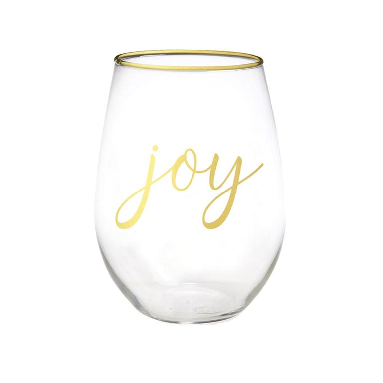 Clear glass wine glass with gold rim and 'joy' text on a white background
