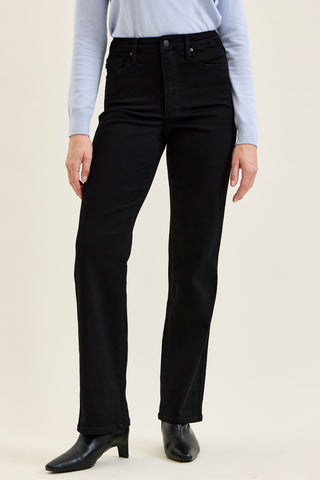 Woman wearing black straight leg jeans