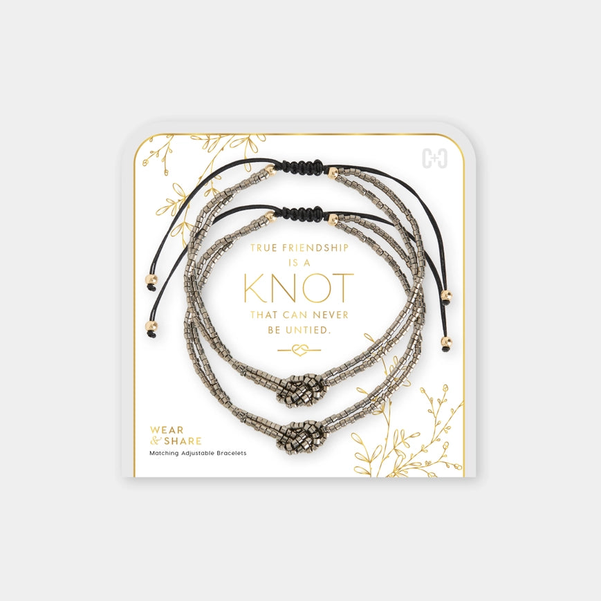 Set of bracelets on a decorative card with text and gold accents