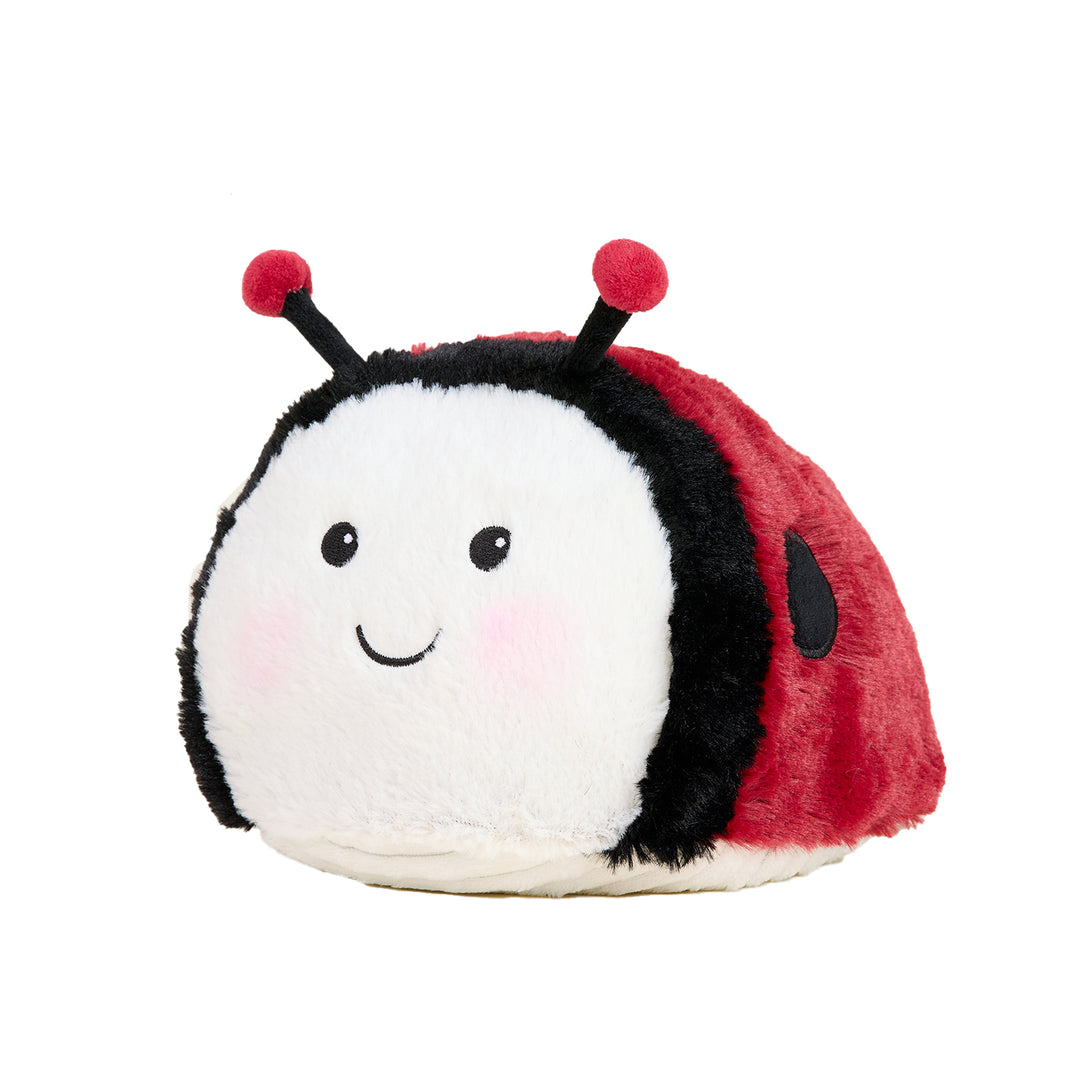 Plush ladybug toy on a white background