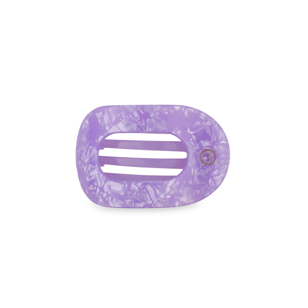 Purple marbled hair clip on a white background