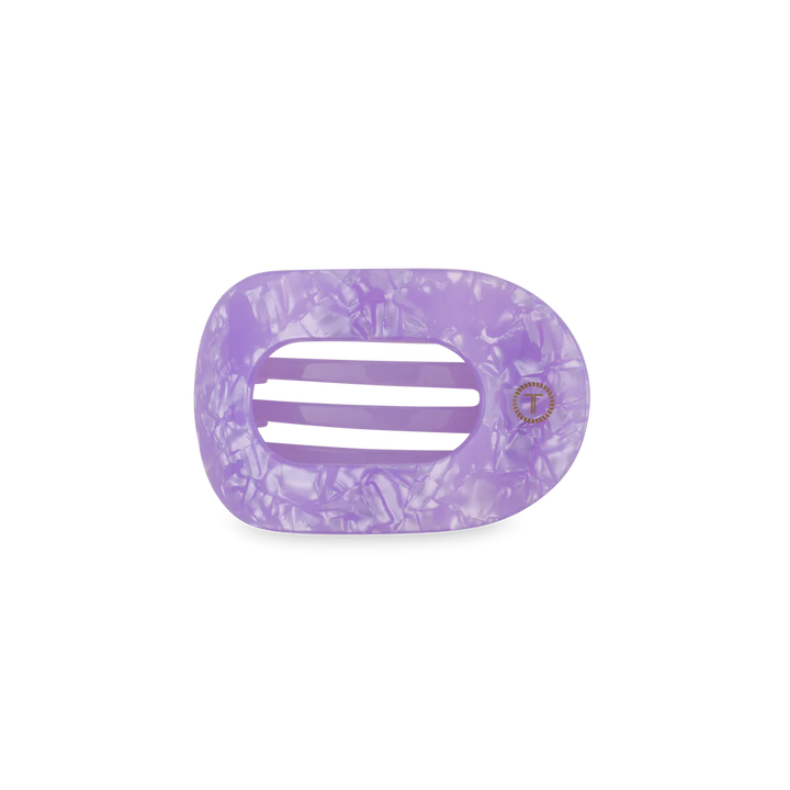 Purple marbled hair clip on a white background
