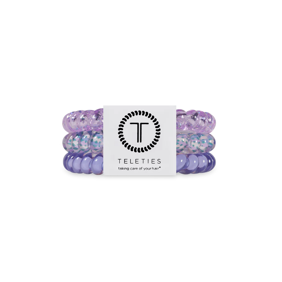 Set of purple hair ties with a Teleties label on a white background