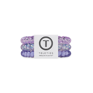Set of purple hair ties with a Teleties label on a white background