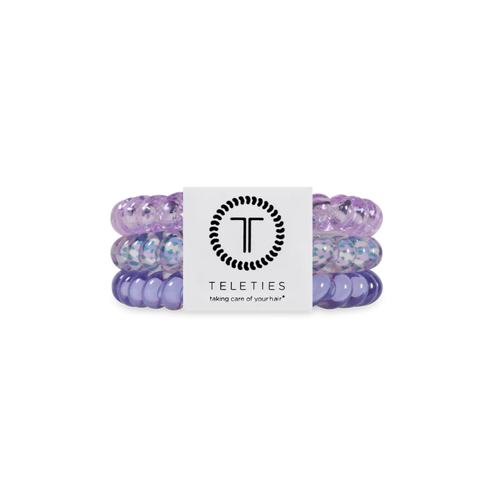 Set of purple hair ties with a Teleties label on a white background