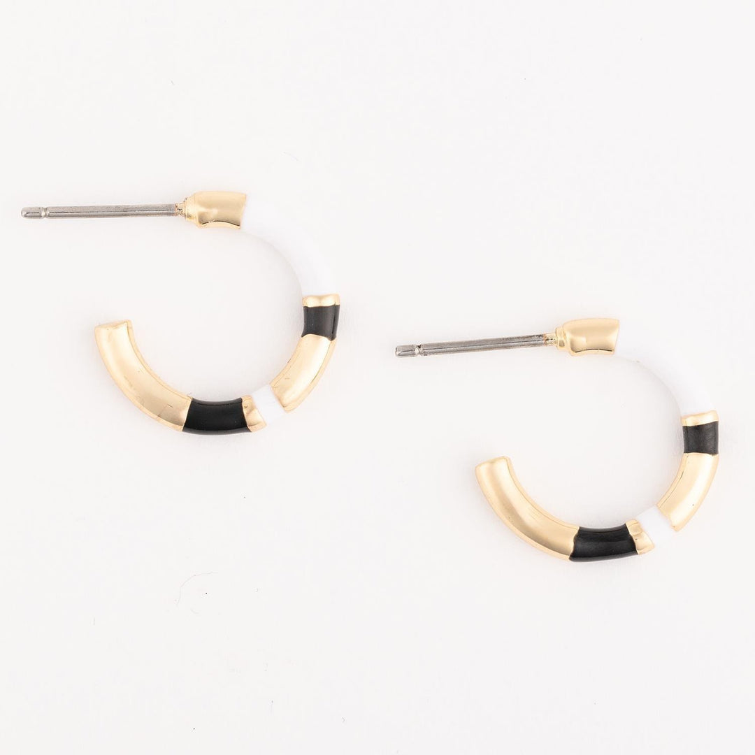 Pair of hoop earrings with gold and black accents on a white background