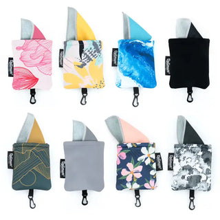Eight small fabric pouches or card holders arranged in a 2x4 grid on a white background. Each pouch has a triangular flap in different colors and patterns, including pink, yellow, blue, black, gray, floral, and abstract designs.