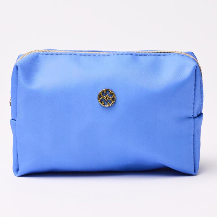 Blue pouch with a gold zipper and logo on a white background