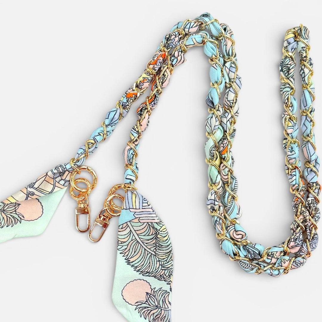 Multicolored braided lanyard with decorative ends on a white background