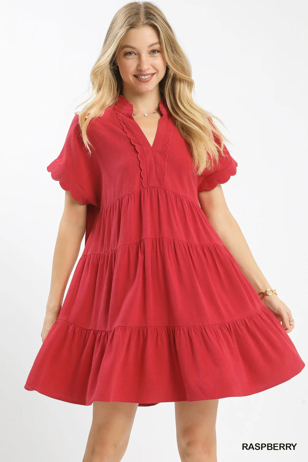 Woman wearing a red dress on a white background