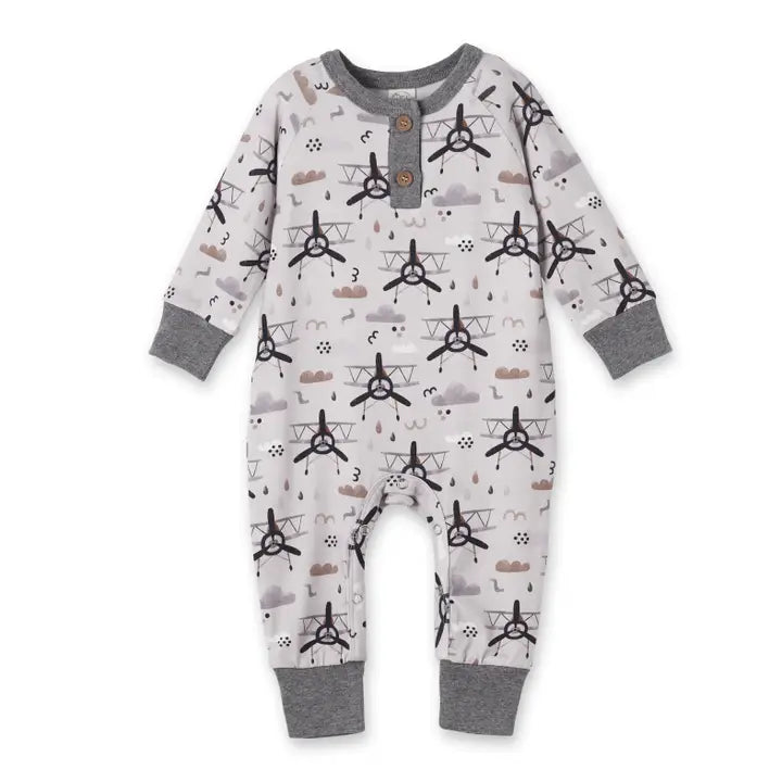 Baby onesie with airplane pattern on a white background