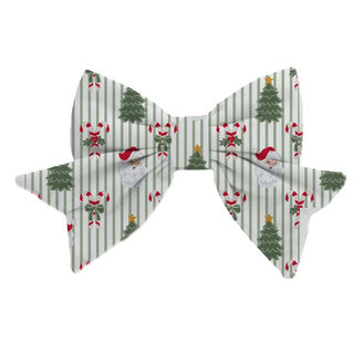 green and white striped fabric bow with santa, tree, and candy cane pattern
