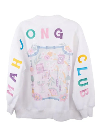 White crewneck sweatshirt with colorful graphic prints on the back and sleeves. The back features the text 'JONG' in multicolor letters above a pastel illustration of a decorative frame with cards and drinks.
