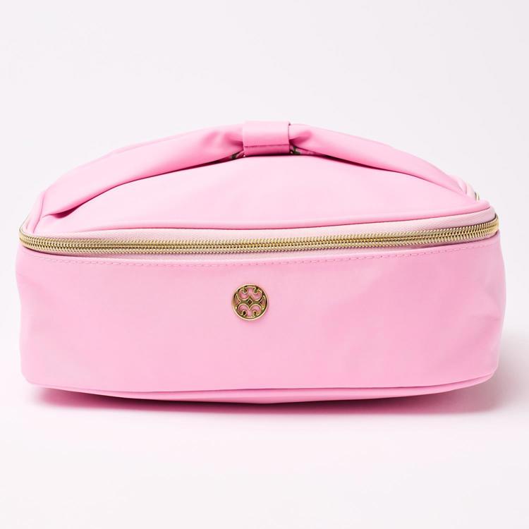 Pink cosmetic bag with gold zipper and logo on a white background