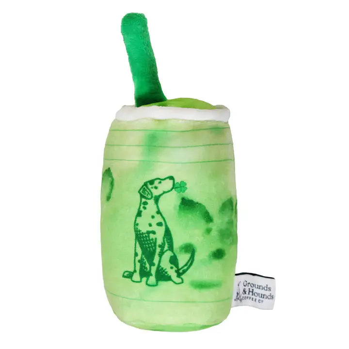 Green plush toy resembling a cup with a dog design on a white background