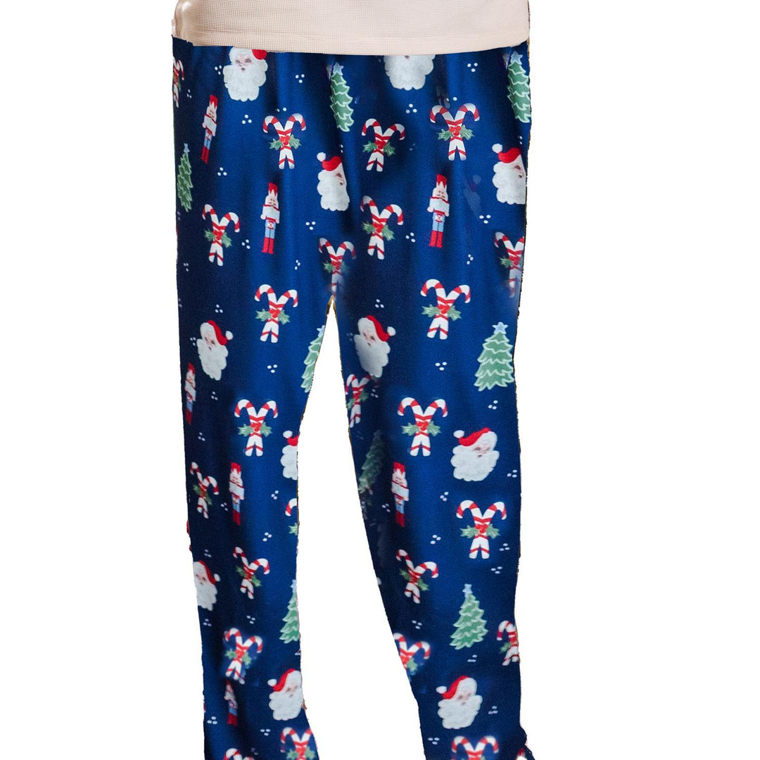 Navy blue leggings with Christmas-themed pattern on a white background
