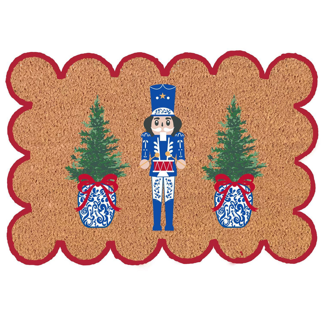 Decorative doormat with a Nutcracker and Christmas trees design on a white background
