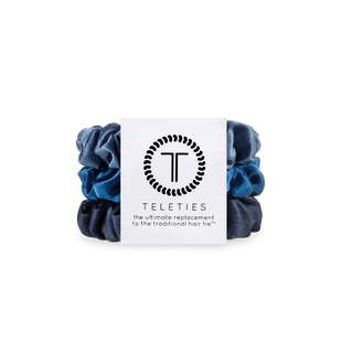 Pack of blue scrunchies with Teleties packaging on a white background