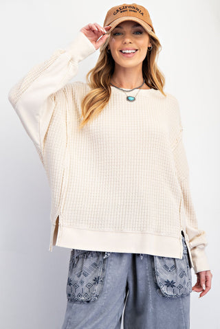 thermal knit pullover in an off white tone