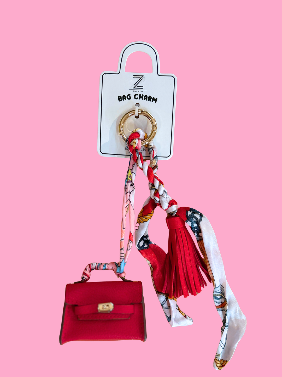 red mini bag charm with scarf and tassel