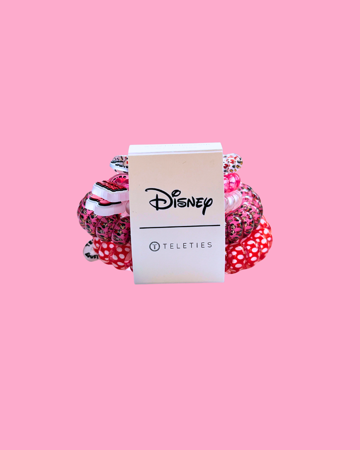 Stack of pink polka dot hair ties with a Disney Teleties tag on a pink background