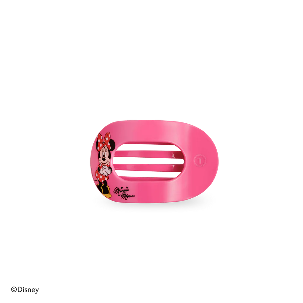 Pink hair clip with Minnie Mouse design on a white background