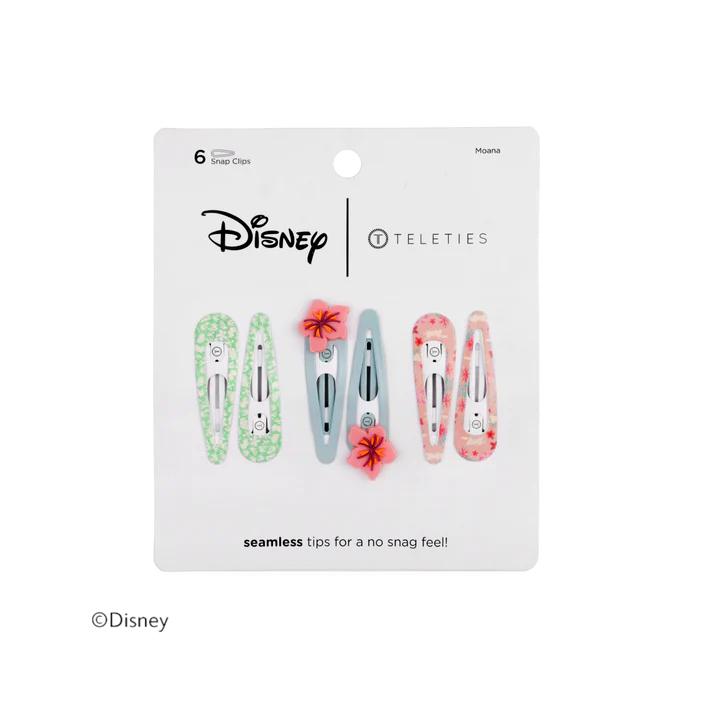 Disney Teleties 6-piece hair clip set in a white hanging card package. The clips feature various pastel patterns including green marble, light blue marble, pink marble, and red floral designs, with two red flower clips decorated with small red flowers.