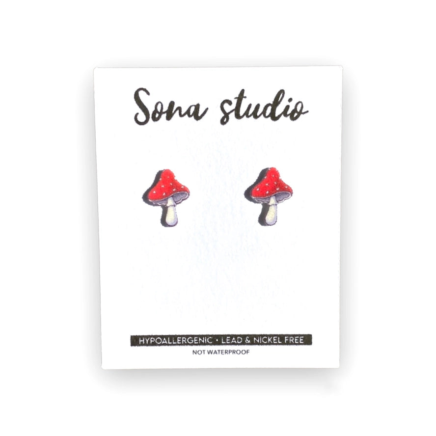 Mushroom-shaped earrings on a Sona Studio branded card with product information.