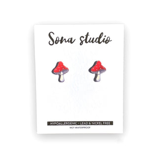 Mushroom-shaped earrings on a Sona Studio branded card with product information.